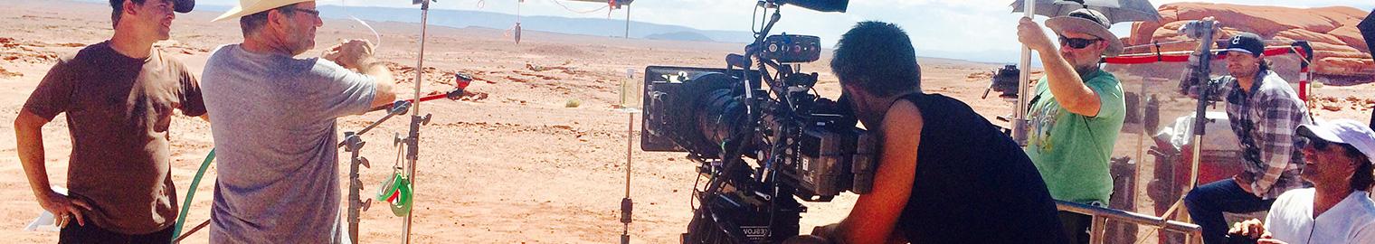 People filming movie in desert